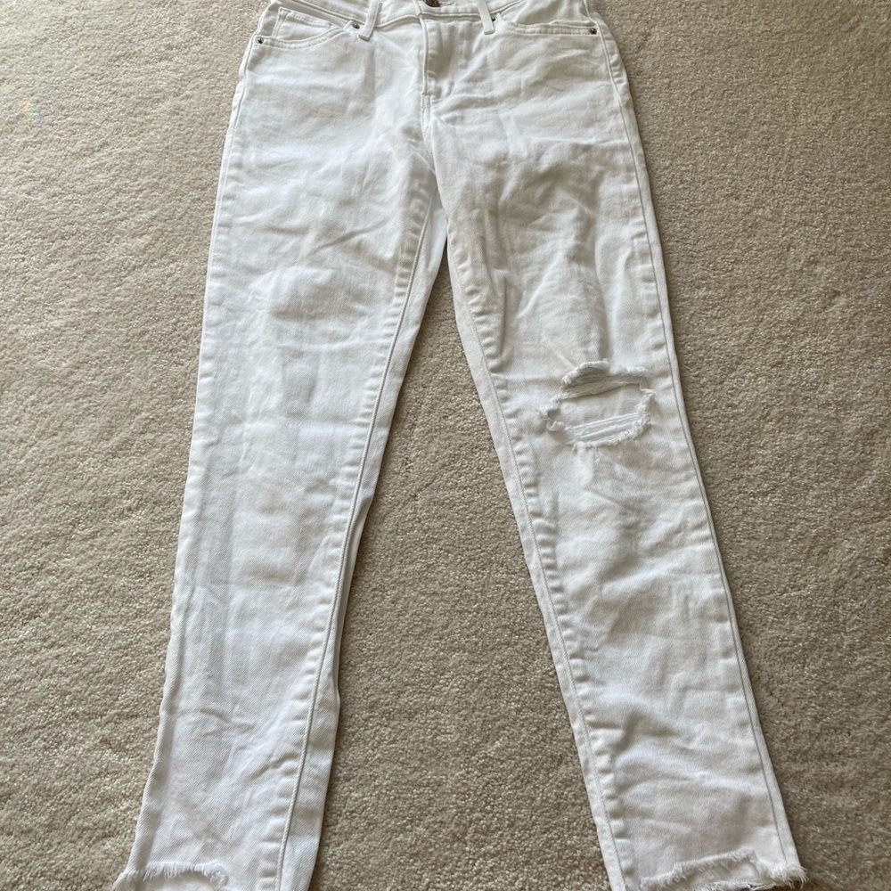 Levi’s distressed white jeans